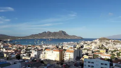 a view of a city with a mountain in the background at Bouganville in Mindelo