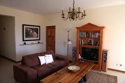 a living room with a couch and a coffee table at Bouganville in Mindelo