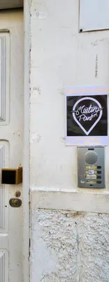 a sign on the side of a building at Meeting Point Hostels-Praia Beachwalk-NO CASH ACCEPTED-Also in Fogo & Tarrafal in Praia