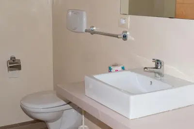 a bathroom with a white sink and a toilet at Ca Marta Penthouse in Sal Rei