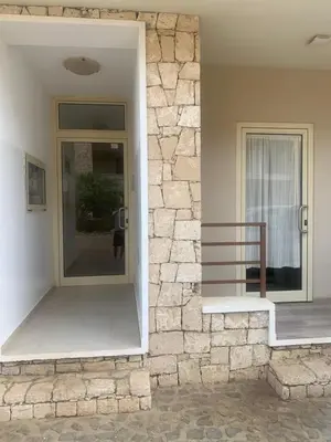 a house with a stone wall and a staircase at Ca Marta Penthouse in Sal Rei