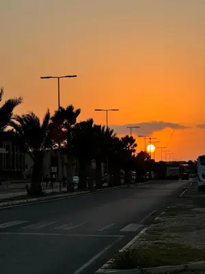 an empty street with the sunset in the background at SAL at HOME in Santa Maria