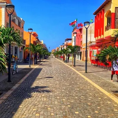 a cobblestone street in a city with colorful buildings at SAL at HOME in Santa Maria