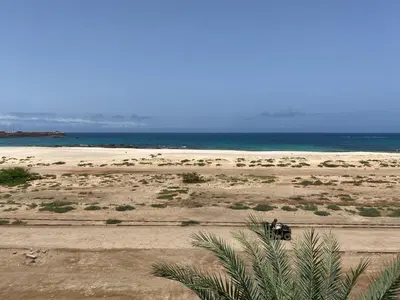 a person driving a truck on the beach at Vista Do Mar Sea View WI-FI FREE Sal Rei in Sal Rei