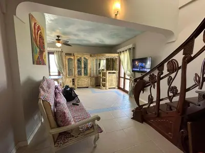 a living room with a staircase and a couch at Vista Do Mar Sea View WI-FI FREE Sal Rei in Sal Rei