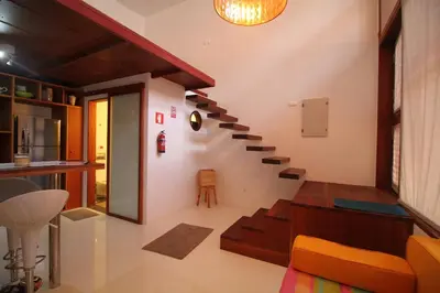 a living room with a staircase in a house at Studio M in Mindelo