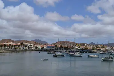 a group of boats are docked in a harbor at Studio M in Mindelo