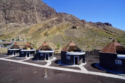 a group of huts sitting on top of a hill at Casa Marisa 2.0 in Portela