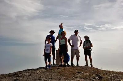 a group of people standing on top of a hill at A Caminhada in Morro