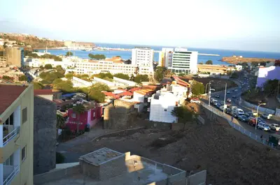 a view of a city with buildings and the ocean at Apartamento Justino in Praia