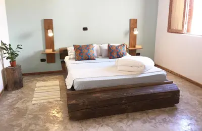 a bedroom with two beds in a room at Casa Pau in Santa Maria