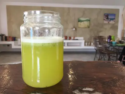 a jar of green liquid sitting on top of a table at Casa Pau in Santa Maria