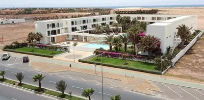 an aerial view of a white building with a street at Hotel Dunas de Sal in Santa Maria