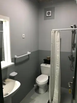 a bathroom with a white toilet and a sink at Salzen Portas de Sol in Santa Maria