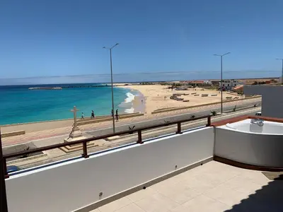 a view of a beach and the ocean from a building at Hotel Casa Evora - luxury and beach front in Vila do Maio