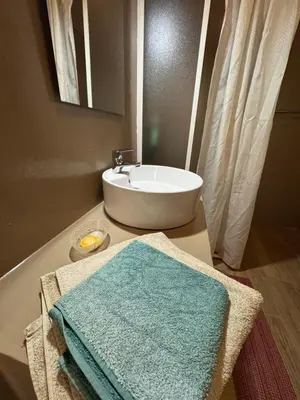 a bathroom with a sink and a towel on a counter at CA MINHA Praia Estoril Sal Rei Boa Vista in Sal Rei