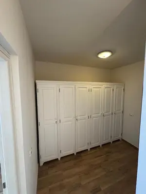 a room with white cabinets and a ceiling at CA MINHA Praia Estoril Sal Rei Boa Vista in Sal Rei