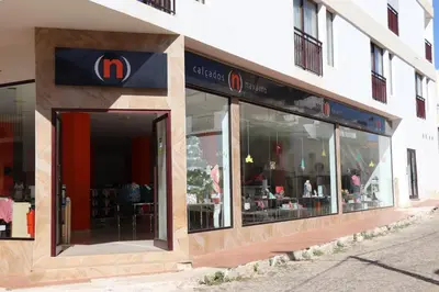 a mcdonalds store with a sign on the side of a building at Apartamento Preguiça in Espargos