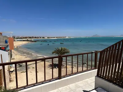 a view of a beach with boats in the water at Casa Tud Dret - By Bobbywashere in Sal Rei