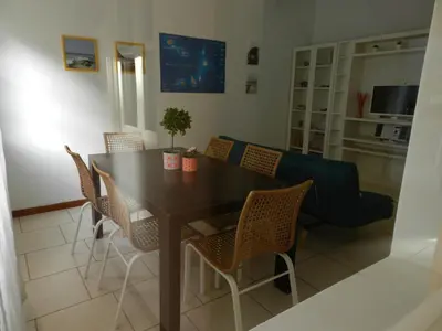 a dining room with a table and chairs at La Residencia in Mindelo