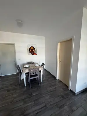 a dining room with a table and chairs at SGC Boa Vista Apartments in Sal Rei