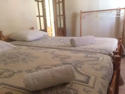 two beds sitting next to each other in a room at Sissi's B&B in Ponta do Sol