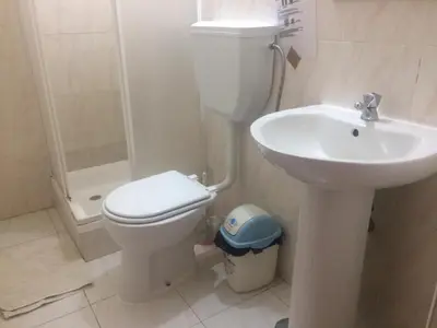 a bathroom with a toilet and a sink at Sissi's B&B in Ponta do Sol