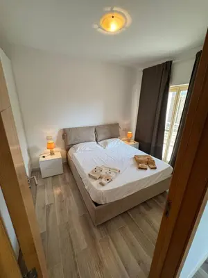 a bedroom with a bed and two lamps on tables at KA ANGELA, WI-FI FREE Praia Cabral, Sal Rei in Sal Rei