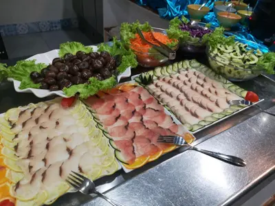 a buffet with different types of meats and vegetables at Halos Casa Resort in Santa Maria