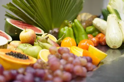 a bunch of fruits and vegetables on a table at Halos Casa Resort in Santa Maria