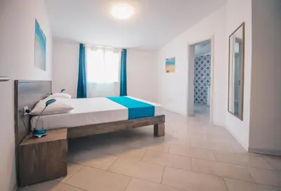 a bedroom with a large bed in a room at Halos Casa Resort in Santa Maria