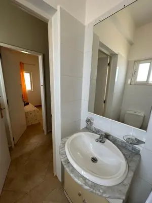 a bathroom with a sink and a mirror at sea View Nautilus free wi-fi Sal Rei in Sal Rei