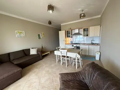 a living room with a couch and a table and a kitchen at sea View Nautilus free wi-fi Sal Rei in Sal Rei