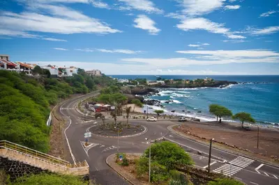 a road on a hill next to the ocean at Aparthotel Praiano in Praia