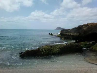a view of the ocean with rocks in the water at Solmar apartment in Beirona