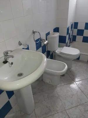 a bathroom with a sink and a toilet at Casa Azul Apt Two Rua da Morna up from Mercado Municipal 4111 in Santa Maria