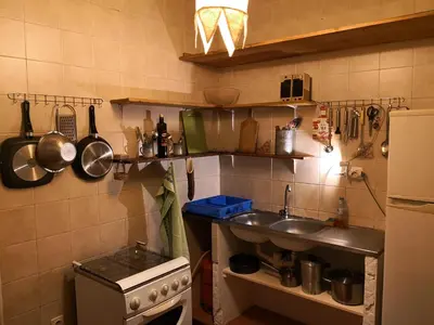 a small kitchen with a sink and a stove at Casa Tabanka Apartment in Tarrafal