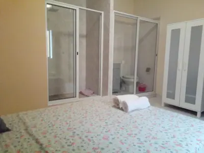 a bedroom with a bed with a towel on it at POUSADA O RECANTO in Paul