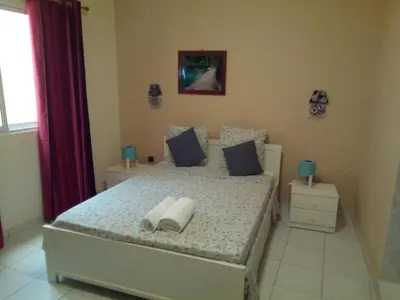 a bedroom with a bed with two pillows on it at POUSADA O RECANTO in Paul