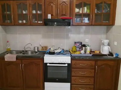 a kitchen with a sink and a stove top oven at POUSADA O RECANTO in Paul