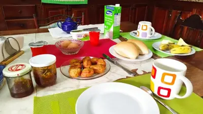 a table with plates of food on a table at Wahnon Guesthouse in Paul