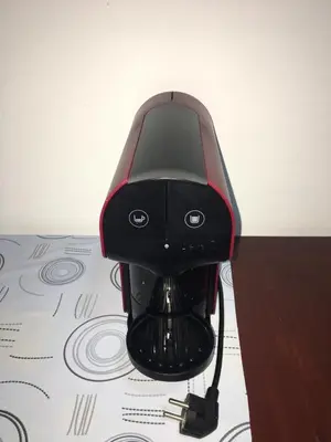 a black and red chair sitting on a table at Apartamento Llana in Santa Maria