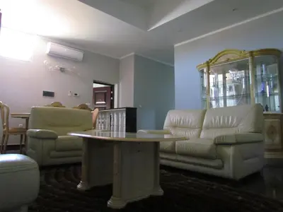 a living room with a couch and a table at Residêncial Carlos Carvalho in Praia