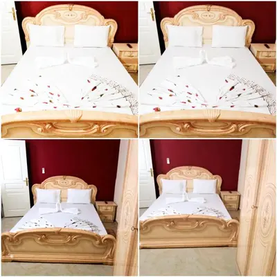 four different views of a bed in a room at Residêncial Carlos Carvalho in Praia