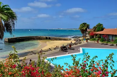 a view of the beach from a resort with a swimming pool at Porto Antigo Top 10 in Santa Maria