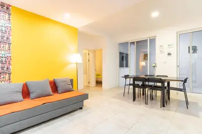 a living room with a couch and a table at Casa Io - Bica in Mindelo
