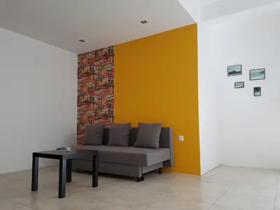 a living room with a couch and a table at Casa Io - Bica in Mindelo