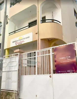 a building with a gate in front of a building at Cantinho C - Alojamento Complementar in Praia