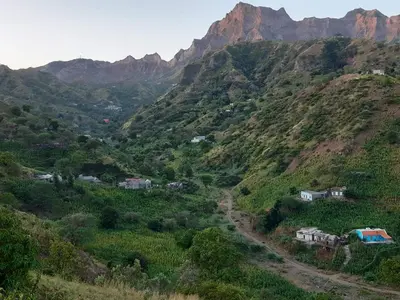 a view of a mountain with houses on it at Casa Pé di Polon holiday home in Picos