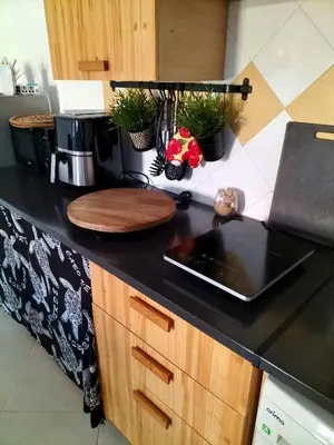 a kitchen counter with a laptop on a counter top at Blue Ocean in Santa Maria